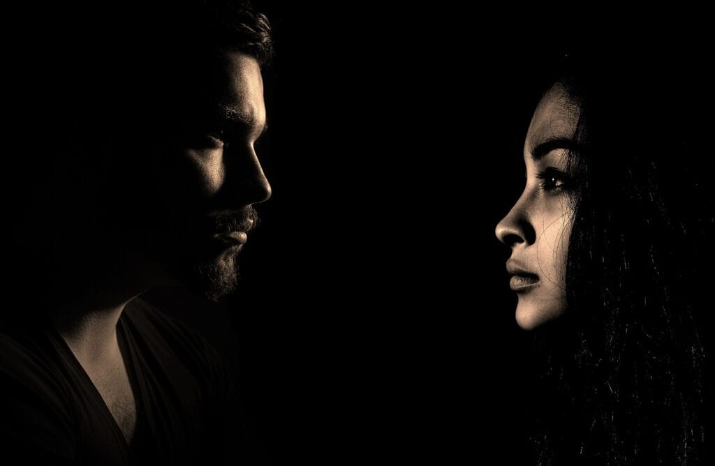 a man and a woman in profile
