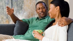 Couple relaxing and talking together at home
