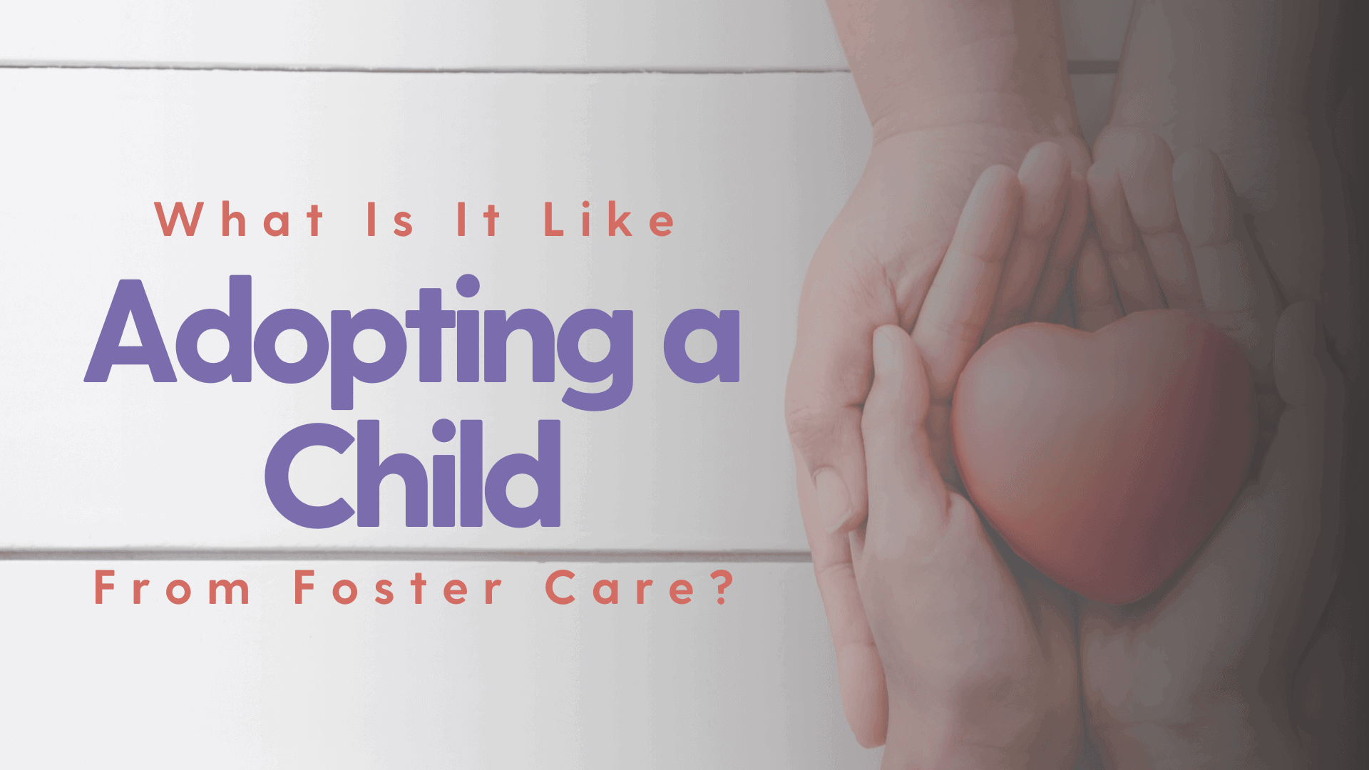And adoptive parent holding the hands of a child who has been adopted with a heart.