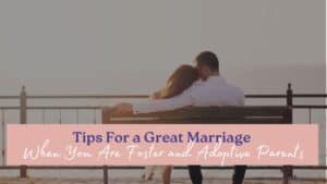 a couple sitting closely on a bench overlooking a scenic view, which emphasizes the need for tips for a great marriage when you are foster or adoptive parents.
